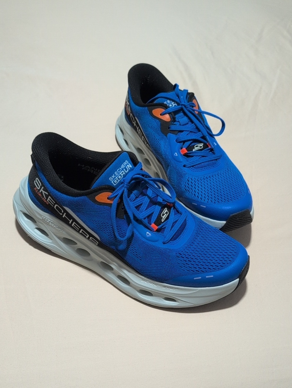 Skechers Men’s Blue and Black Athletic Running Shoes with Orange Accents